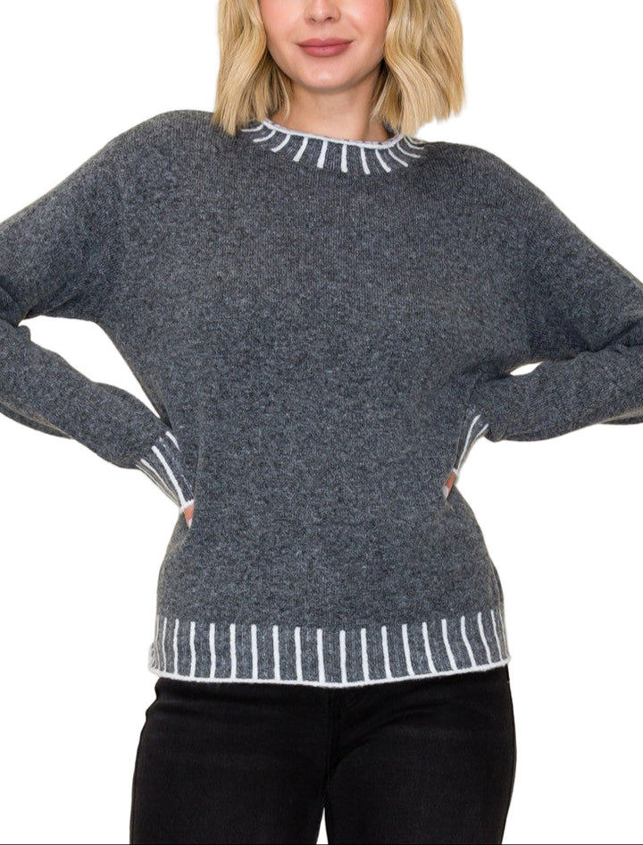 Stay cozy and stylish in the Kerr Mock Neck Sweater, featuring a charming color texture accent that adds a fun twist to your everyday look. Its playful mock neck design keeps you snug while letting your personality shine. Perfect for layering or wearing solo, this sweater brings warmth and a pop of character to chilly days.