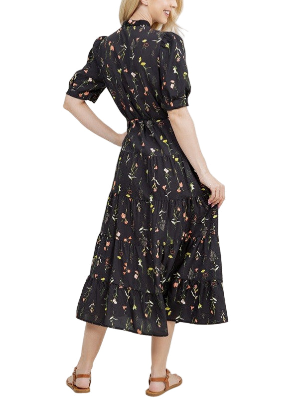 A beautiful floral dress with short sleeves and a tie waist.