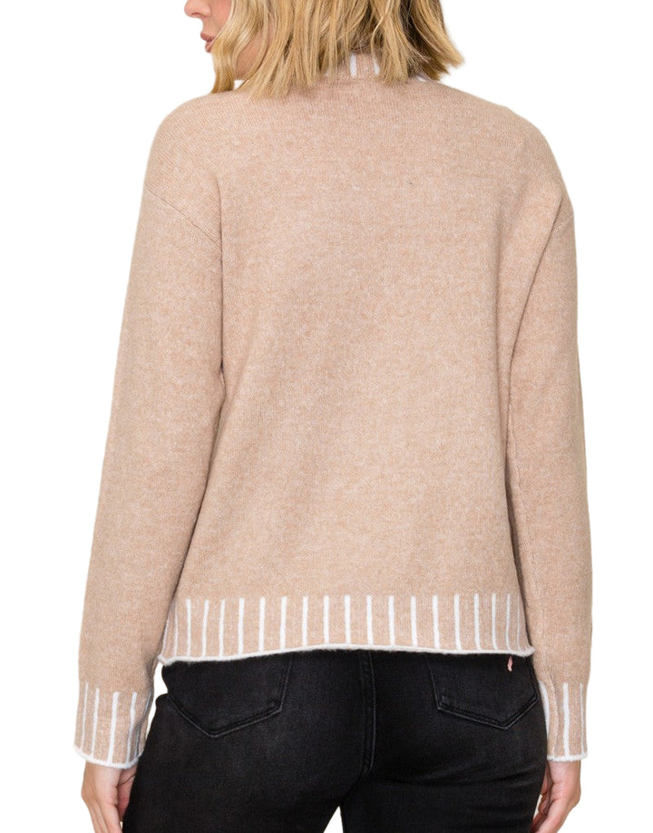Stay cozy and stylish in the Kerr Mock Neck Sweater, featuring a charming color texture accent that adds a fun twist to your everyday look. Its playful mock neck design keeps you snug while letting your personality shine. Perfect for layering or wearing solo, this sweater brings warmth and a pop of character to chilly days.
