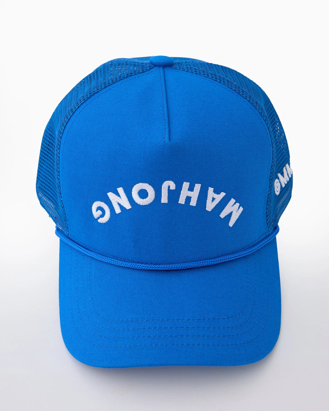 Flip the script with the Oh My Mahjong Upside-Down Trucker Hat! This cobalt blue cotton trucker hat puts a fresh spin on game-day style. With OMM embroidered on the breathable mesh siding, this hat is the perfect mix of classic comfort and playful charm. A must-have for every mahjong lover who knows how to rack, roll, and ignore the status quo! Adjustable design ensures a personalized fit for all head sizes.