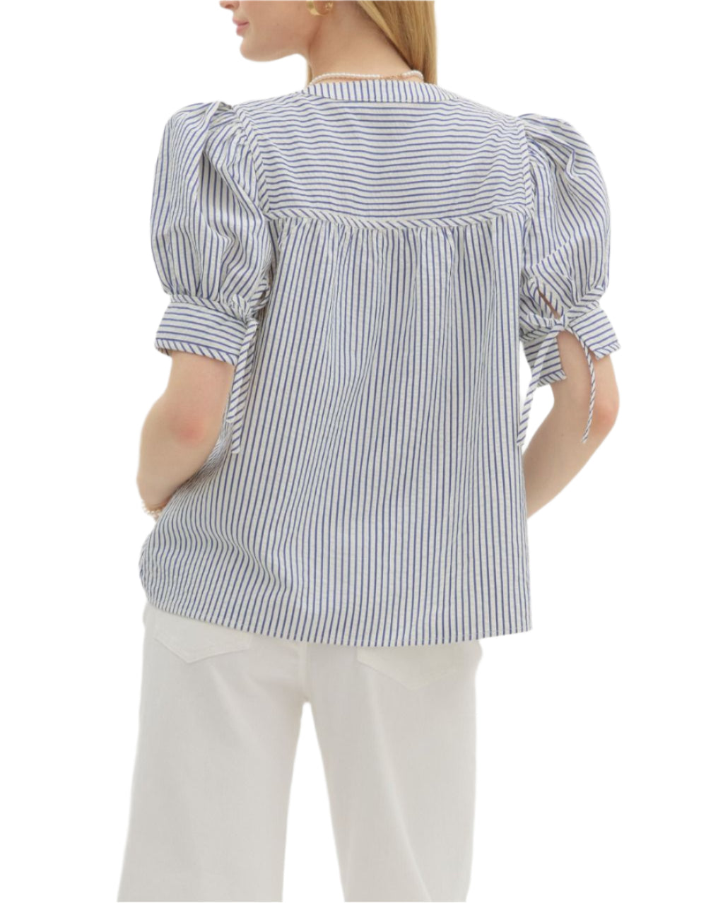 Stripe pattern structured shoulder short sleeve pullover top featuring bow tie closure cuff band. Button front closure. Unlined. Woven. Non-sheer. Lightweight.