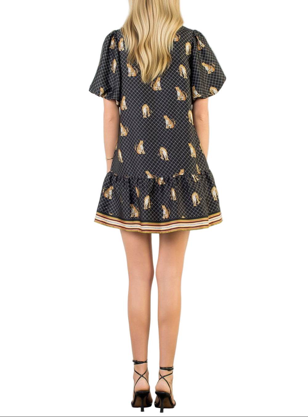 Unleash your wild side with the Aria Black Leopard Print Dress—a playful take on a classic pattern that's anything but boring. This short dress features a striking black leopard print that commands attention while remaining effortlessly wearable. Perfect for nights out, casual dates, or whenever you want to add a dash of attitude to your wardrobe. The flattering cut keeps things fun and flirty, making it a go-to piece for anyone who loves bold style with a sense of humor.