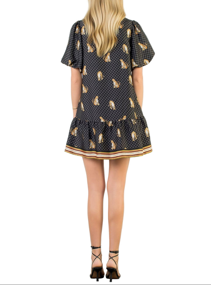 Unleash your wild side with the Aria Black Leopard Print Dress—a playful take on a classic pattern that's anything but boring. This short dress features a striking black leopard print that commands attention while remaining effortlessly wearable. Perfect for nights out, casual dates, or whenever you want to add a dash of attitude to your wardrobe. The flattering cut keeps things fun and flirty, making it a go-to piece for anyone who loves bold style with a sense of humor.