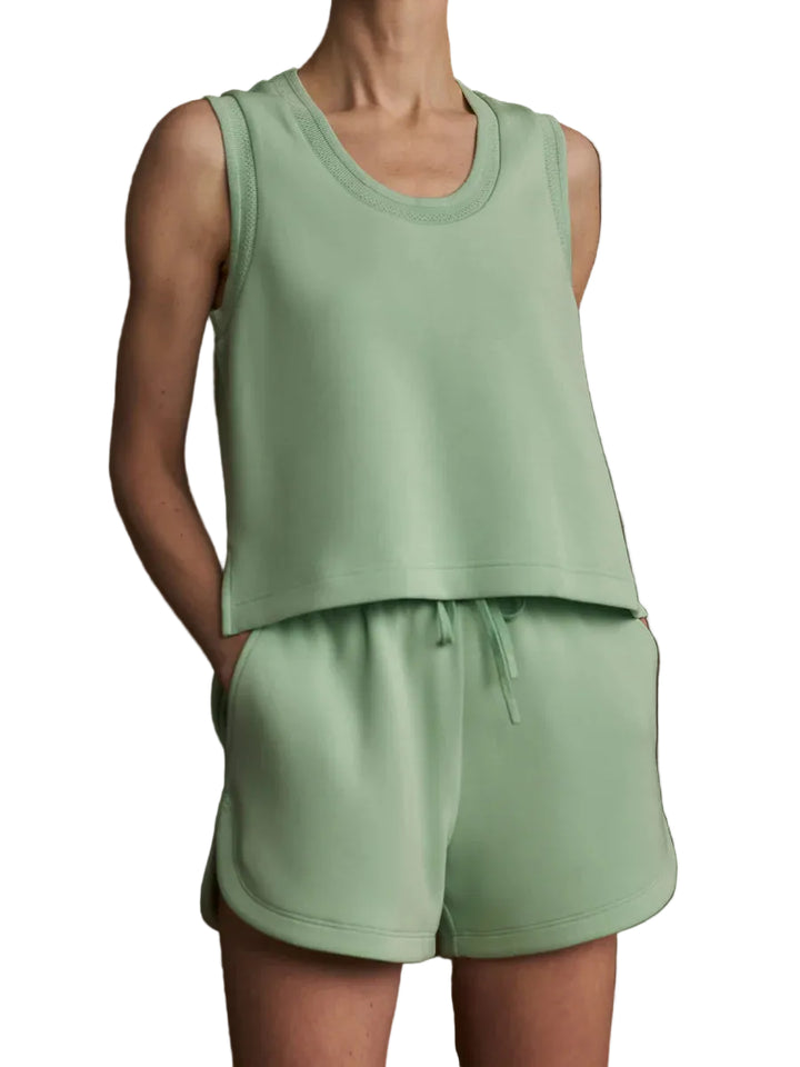 Made from DoubleSoft®, this scoop-neck tank features decorative trim and side splits for comfort and ease. Its slightly cropped silhouette makes it a versatile piece for effortless styling.