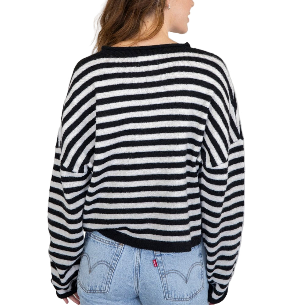 Soft and cozy lightweight cardigan with rolled edge finish on the sleeves and collar.
