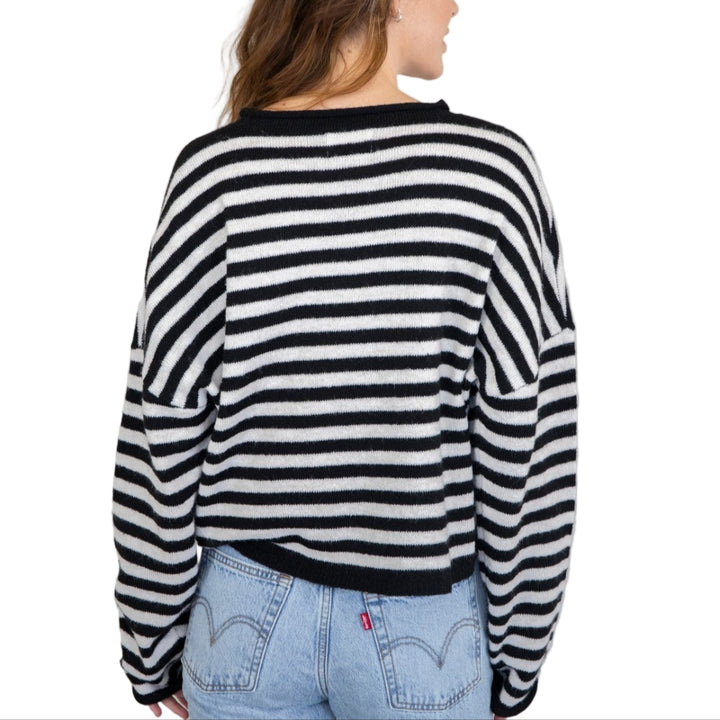 Soft and cozy lightweight cardigan with rolled edge finish on the sleeves and collar.