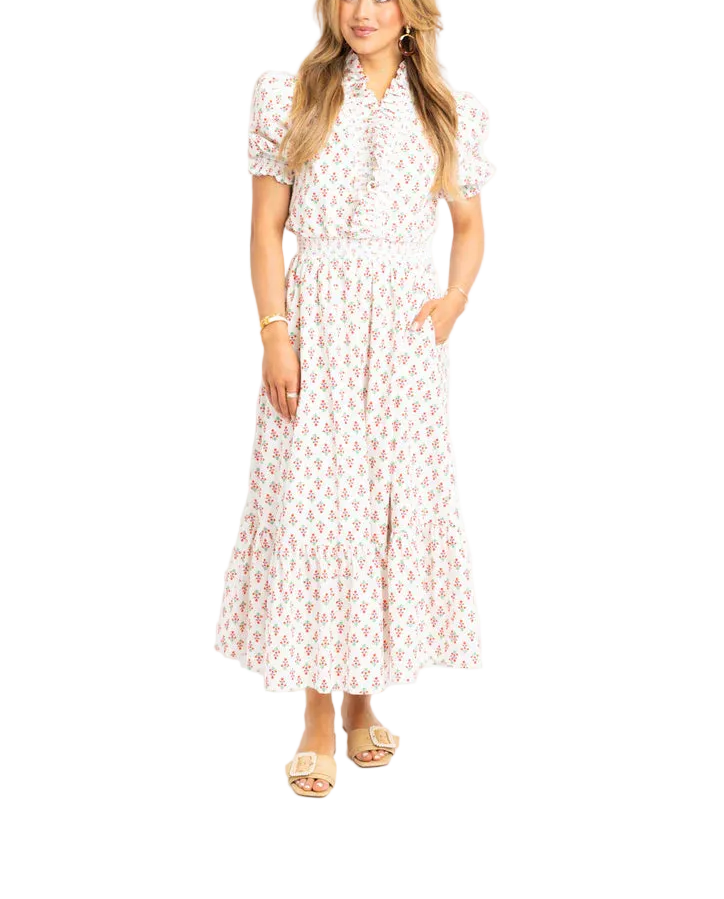 Effortless elegance meets comfort in this digital floral ruffle smock maxi dress. The soft ivory base features a vibrant all-over floral print that brings movement and personality to your wardrobe. Delicate ruffles frame the neckline and sleeves, while the relaxed smock silhouette provides a flattering, breathable fit perfect for warm weather. The flowing maxi length offers timeless sophistication for casual outings, garden parties, or weekend getaways.