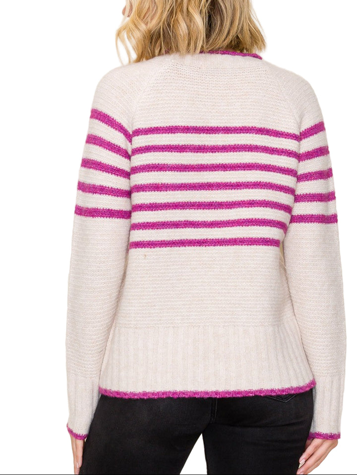Bring a pop of fun to your wardrobe with the Polly Striped Sweater! This cozy crew neck features cheerful stripes that brighten any day while keeping you snug. Perfect for layering or wearing solo, it’s the playful twist your outfit has been waiting for.