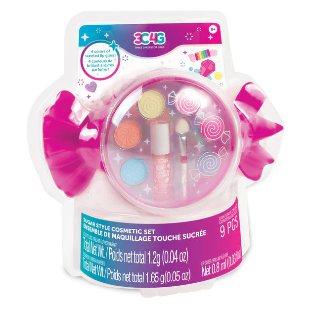 Take this sweet set on the go! Complete with a colorful selection of eyeshadow and scented lip gloss stored in a cute candy-shaped case, this set is sure to sweeten any fashionista’s day. Includes 3 vanilla-scented solid lip gloss colors, 3 eyeshadow colors, and 1 strawberry-scented lip gloss wand. The included cosmetic applicator makes styling easy! All cosmetics are safety tested for kids ages 8+. Mix and match colors to try out different looks and explore new glam! 