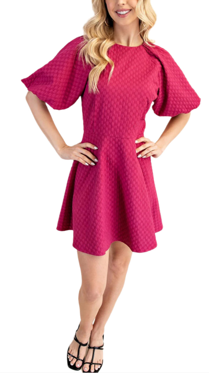 The Ruby Mini Dress is a round-necked mini dress that features playful puff sleeves. Perfect for dressing up (or down), this dress is sure to bring some fun and flirty vibes to your wardrobe.