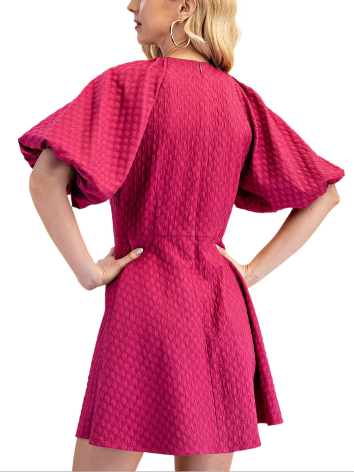The Ruby Mini Dress is a round-necked mini dress that features playful puff sleeves. Perfect for dressing up (or down), this dress is sure to bring some fun and flirty vibes to your wardrobe.