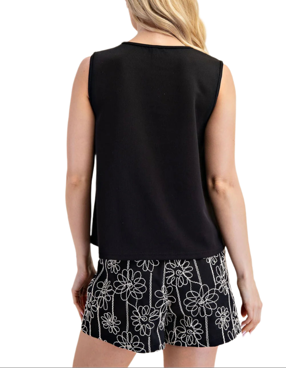Meet Josie, the sleeveless top with side buttons for added flare. This top is perfect for any occasion.
