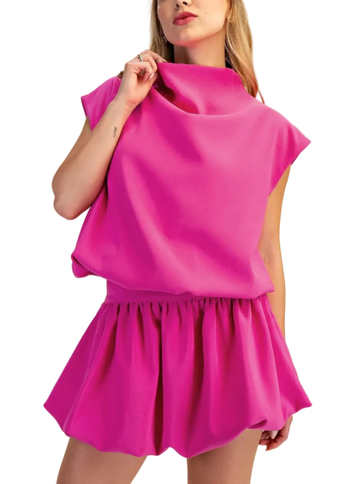 This versatile piece features a flattering mock neck and voluminous balloon sleeves that create a sophisticated silhouette perfect for both casual and polished occasions. The relaxed fit allows for easy layering while maintaining a refined look.&amp;nbsp;
