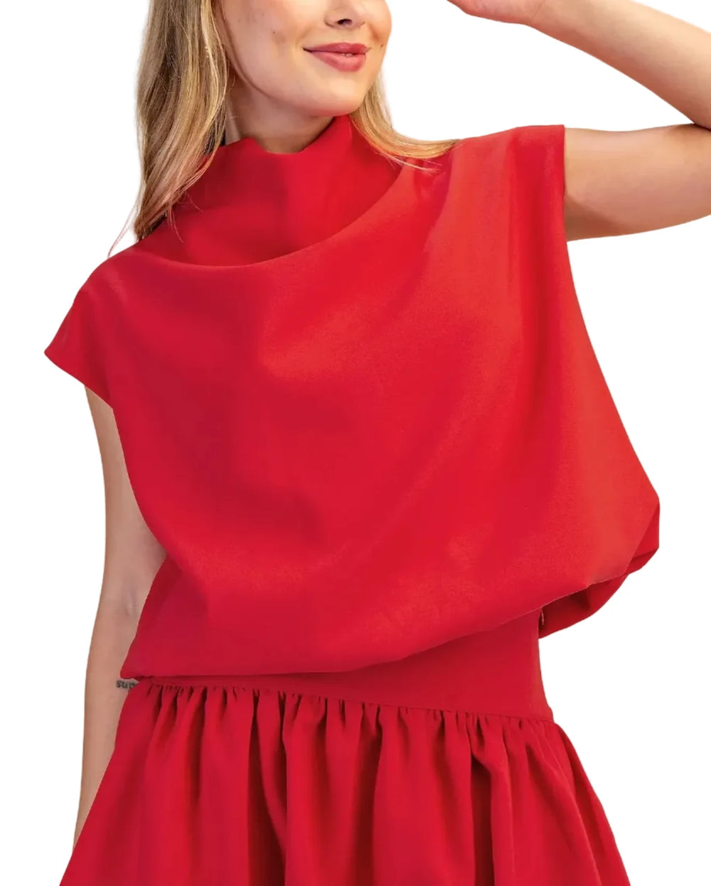 This versatile piece features a flattering mock neck and voluminous balloon sleeves that create a sophisticated silhouette perfect for both casual and polished occasions. The relaxed fit allows for easy layering while maintaining a refined look.&nbsp;