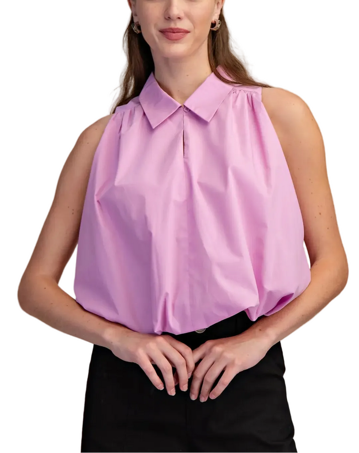 The Blake Sleeveless Top is your new warm-weather essential with a fun twist. This breezy sleeveless design keeps you cool and comfortable, while the charming bubble hem adds a playful touch that elevates any casual outfit. Perfect for layering over a tee or wearing solo, it&