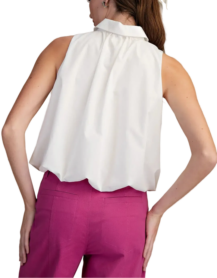 The Blake Sleeveless Top is your new warm-weather essential with a fun twist. This breezy sleeveless design keeps you cool and comfortable, while the charming bubble hem adds a playful touch that elevates any casual outfit. Perfect for layering over a tee or wearing solo, it&