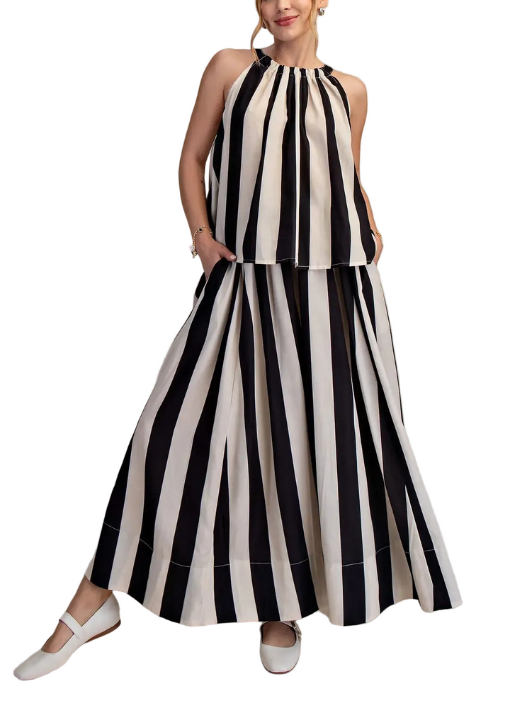 Elevate your everyday style with this effortless two-piece set! The stripe flare maxi skirt brings movement and flair to your wardrobe, while the round neck sleeveless top keeps things cool and comfortable. Perfect for casual outings, weekend adventures, or those days when you want to look put-together without trying too hard. Mix, match, and make it your own—this dynamic duo works solo or paired together for maximum versatility and fun!