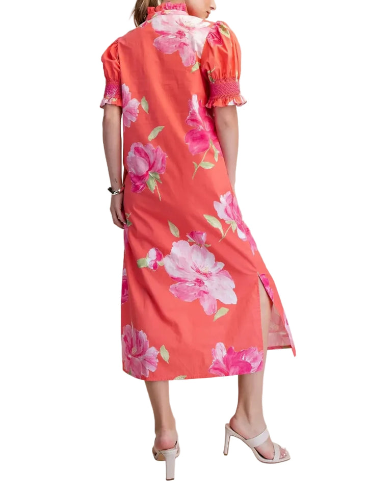 Embrace effortless charm with this stunning floral print midi dress. Designed for the modern woman, this casual dress features a flattering silhouette with delicate puff sleeves and a chic high neckline. The vibrant pink floral pattern pops against a crisp white background, making it a perfect choice for sunny days and garden parties. Crafted from a lightweight fabric, this dress offers comfort and style for any occasion. Its flowy design and midi length create a graceful movement, while the short sleeves a