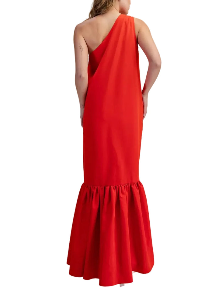 Make a striking entrance with this effortless yet architectural statement piece. Designed in a vibrant color, this maxi dress features a chic, asymmetrical one-shoulder neckline that drapes elegantly into a relaxed, flowing bodice. The standout feature is the dramatic, drop-waist ruffled hem, which adds stunning volume and movement as you walk. Whether you are attending a summer wedding, a resort getaway, or a daytime garden party, this dress perfectly balances high-fashion flair with all-day comfort.