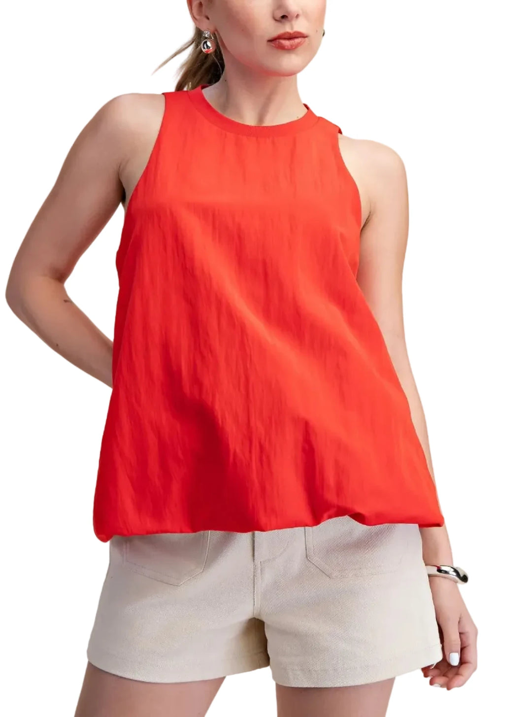 This puffy bottom hem sleeveless top is a must-have for any fashion-forward wardrobe. Crafted from a lightweight, breathable fabric, it offers both comfort and style for warmer days. The flattering cut drapes beautifully, creating a relaxed yet sophisticated silhouette that pairs effortlessly with a variety of bottoms. Its simple yet striking design makes it a versatile piece, perfect for dressing up or down. It&