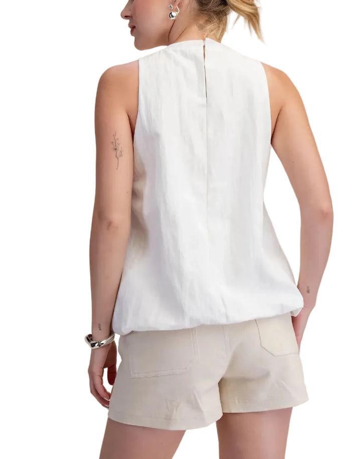 This puffy bottom hem sleeveless top is a must-have for any fashion-forward wardrobe. Crafted from a lightweight, breathable fabric, it offers both comfort and style for warmer days. The flattering cut drapes beautifully, creating a relaxed yet sophisticated silhouette that pairs effortlessly with a variety of bottoms. Its simple yet striking design makes it a versatile piece, perfect for dressing up or down. It&