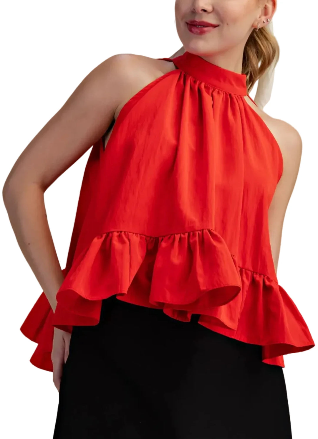 This exquisite halter top is a true embodiment of modern elegance and playful sophistication. Crafted from a lightweight, flowing fabric, it drapes beautifully, creating a flattering silhouette that is both airy and romantic. The halter neckline and the tie neck, a timeless classic, is elevated with a dramatic ruffled collar that frames the face and adds a touch of romantic flair. The voluminous, tiered ruffle detailing cascades down the bodice and flares out at the hem, creating a dynamic and eye-catching 