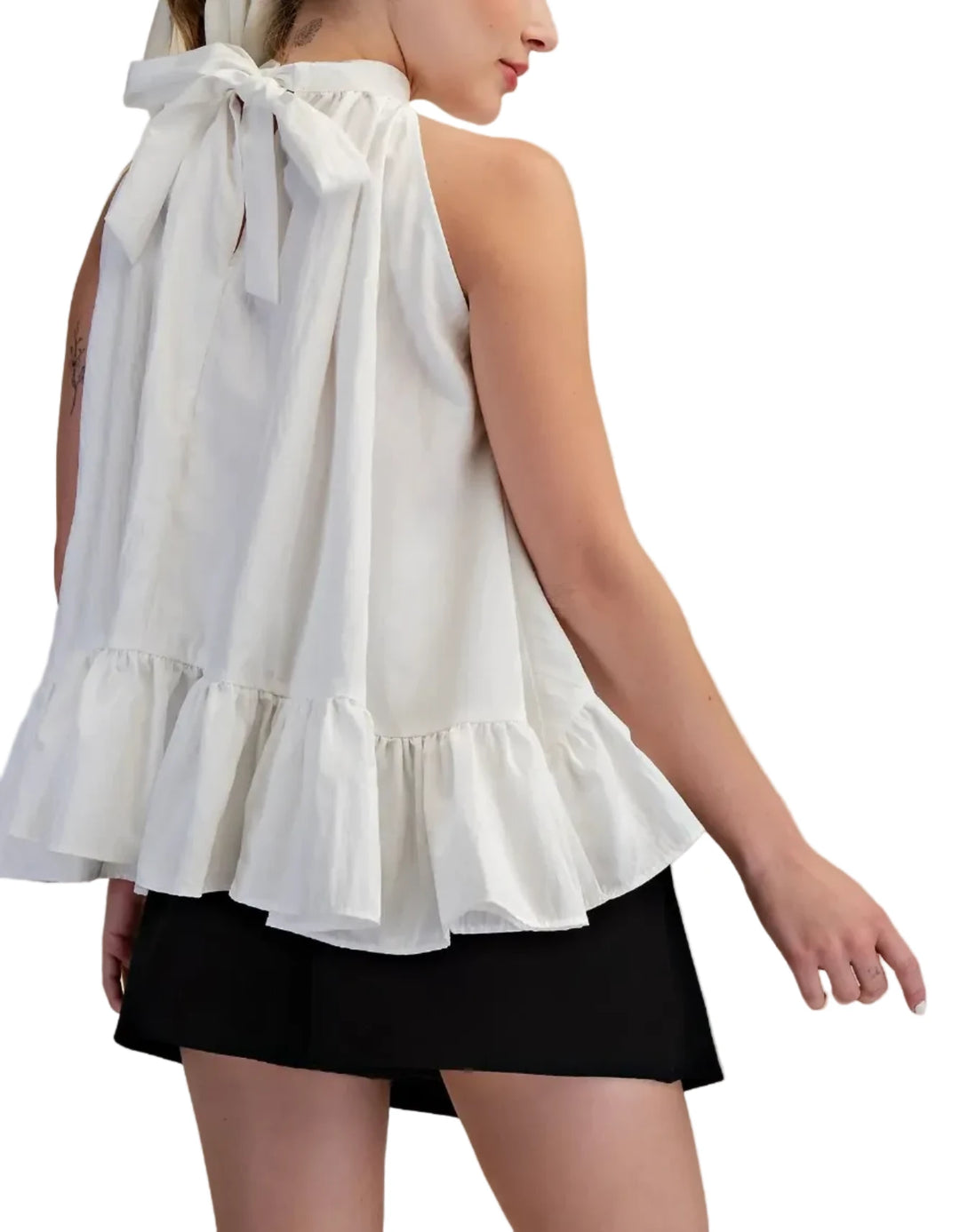 This exquisite halter top is a true embodiment of modern elegance and playful sophistication. Crafted from a lightweight, flowing fabric, it drapes beautifully, creating a flattering silhouette that is both airy and romantic. The halter neckline and the tie neck, a timeless classic, is elevated with a dramatic ruffled collar that frames the face and adds a touch of romantic flair. The voluminous, tiered ruffle detailing cascades down the bodice and flares out at the hem, creating a dynamic and eye-catching 
