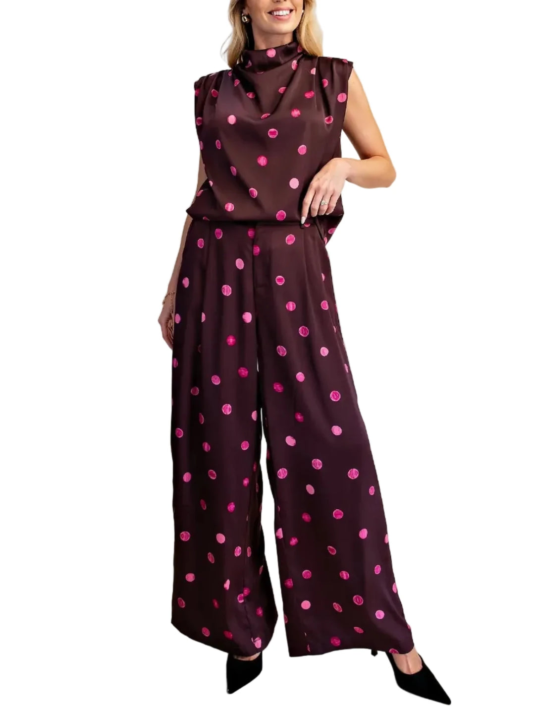 Elevate your wardrobe with this stunning polka dot dress pant set. Crafted from a luxurious, flowing fabric, this set offers both comfort and sophisticated style. Perfect for a variety of occasions, from important business meetings to chic evening events, these pants can be effortlessly dressed up or down. Pair them with a matching top for a polished look, or a casual tee and sneakers for a more relaxed vibe. The impeccable tailoring ensures a flawless fit, making these pants a must-have addition for any fa