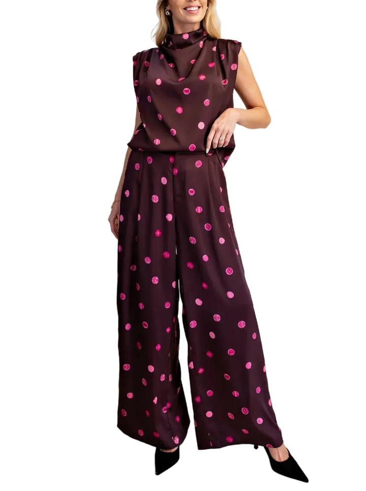 Elevate your wardrobe with this stunning polka dot dress pant set. Crafted from a luxurious, flowing fabric, this set offers both comfort and sophisticated style. Perfect for a variety of occasions, from important business meetings to chic evening events, these pants can be effortlessly dressed up or down. Pair them with a matching top for a polished look, or a casual tee and sneakers for a more relaxed vibe. The impeccable tailoring ensures a flawless fit, making these pants a must-have addition for any fa