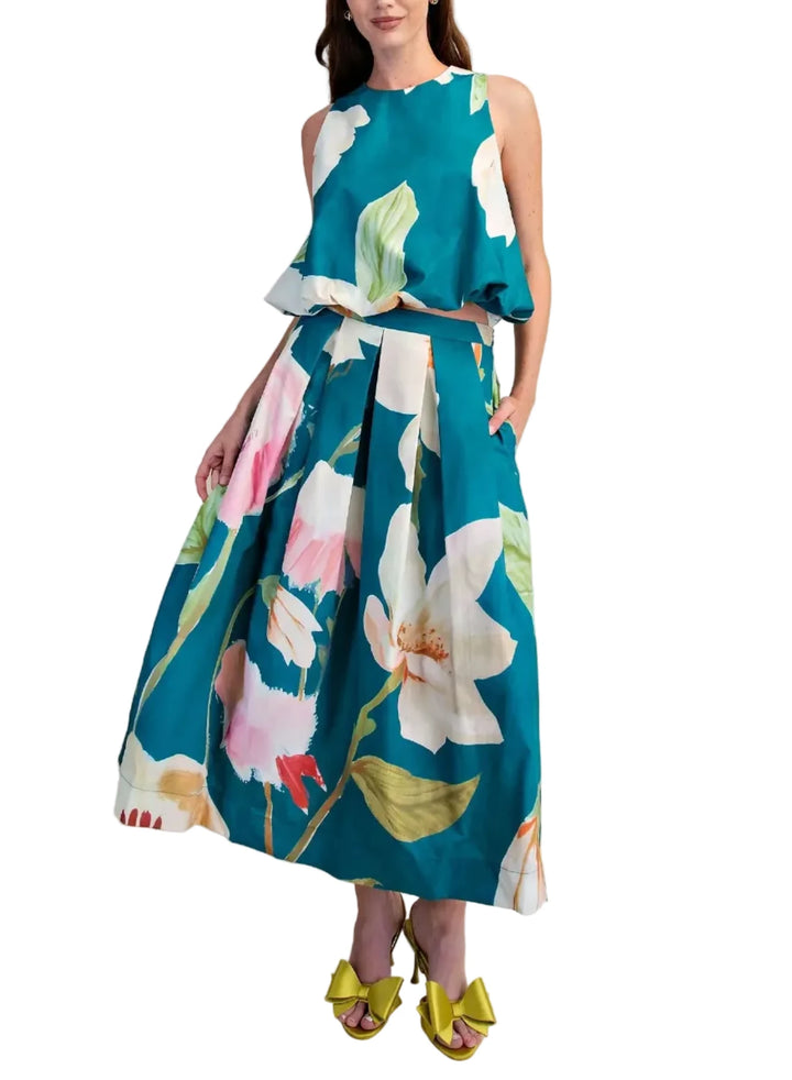 Embrace effortless elegance with this stunning floral midi skirt set, a true statement piece from our latest collection. Crafted from a lightweight, breathable fabric, it features a captivating oversized floral print in vibrant shades of pink and white, set against a softly textured background.&amp;nbsp;