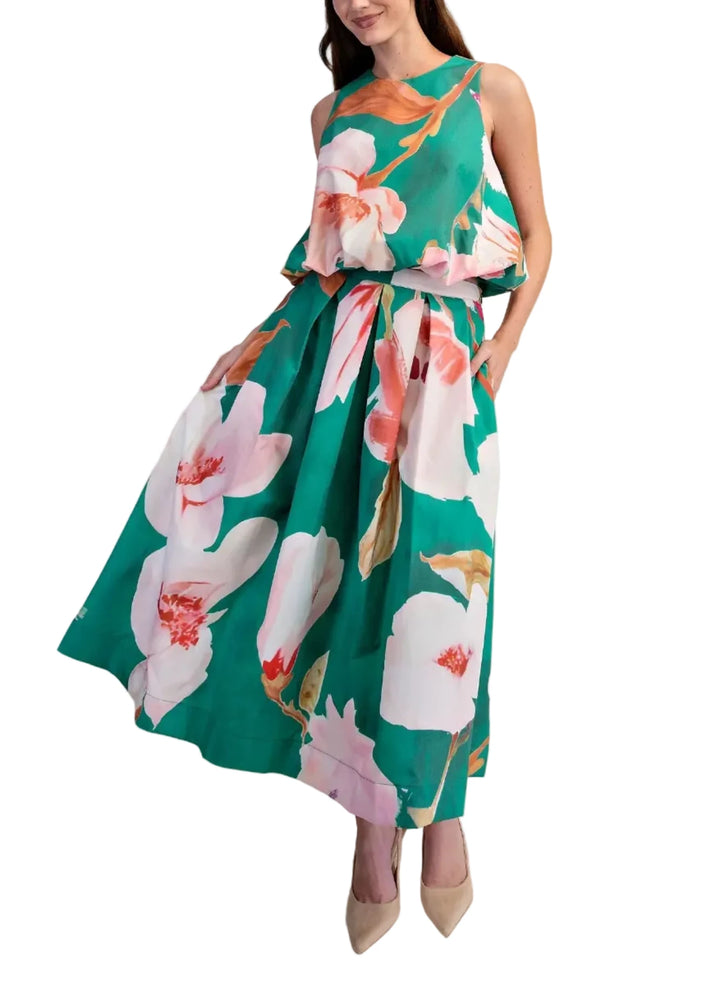 Embrace effortless elegance with this stunning floral midi skirt set, a true statement piece from our latest collection. Crafted from a lightweight, breathable fabric, it features a captivating oversized floral print in vibrant shades of pink and white, set against a softly textured background.&amp;nbsp;