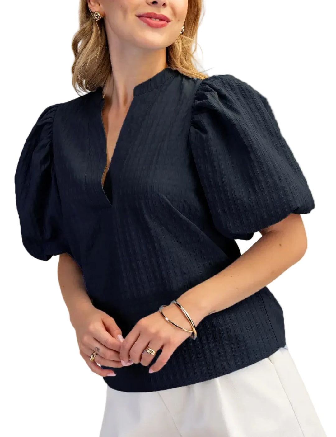 Elevate your wardrobe with this stunning puff sleeve top, designed to make a statement. Featuring dramatic puff sleeves and a unique waffle textured fabric, this blouse offers a sophisticated yet modern silhouette. The flattering V-neckline with a subtle keyhole detail adds a touch of allure, while the short sleeves provide comfort and ease of movement. Crafted from a high-quality material, this top drapes beautifully and feels as good as it looks. Perfect for dressing up or down, it pairs effortlessly with