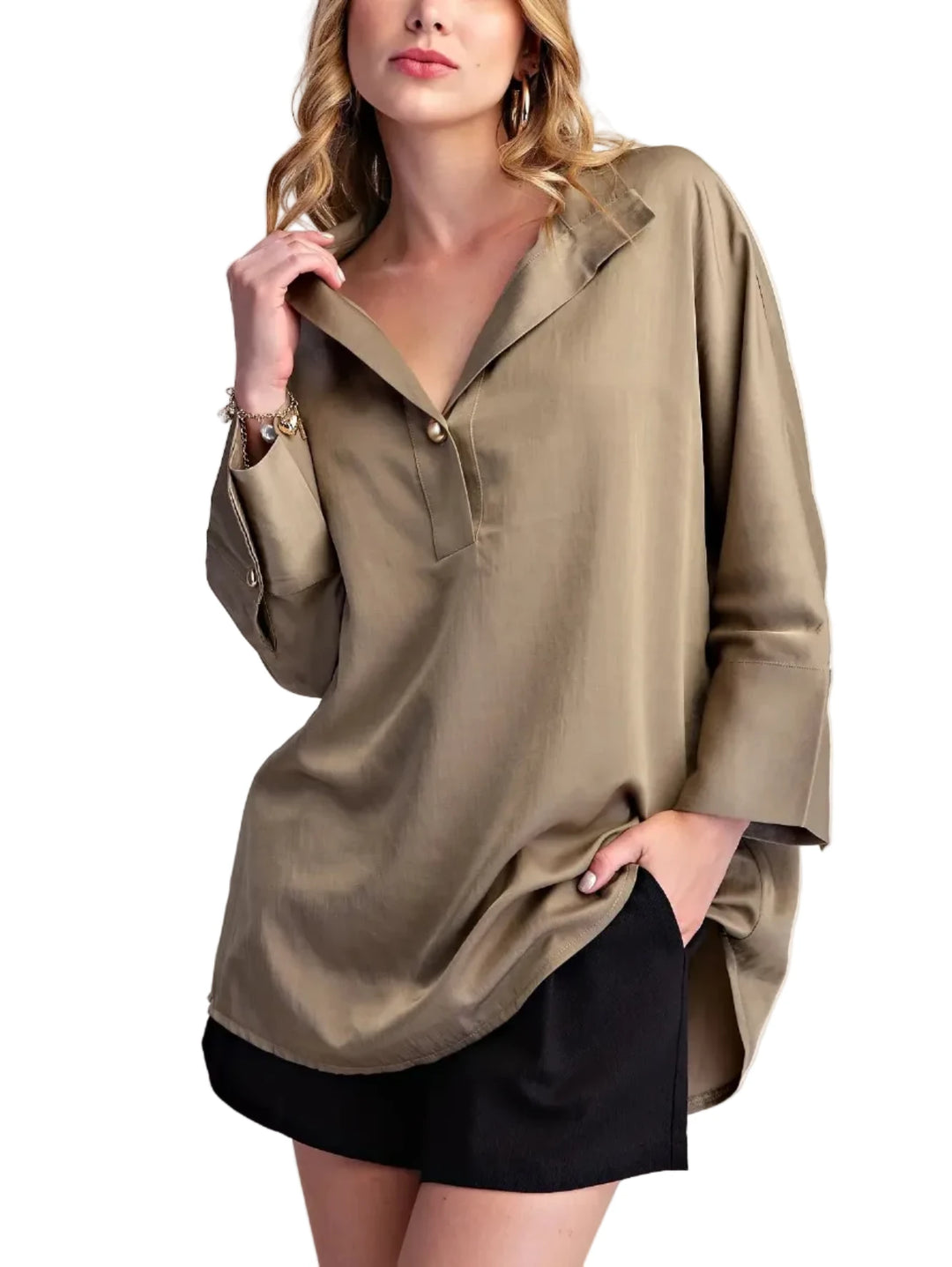 Elevate your casual style with this chic collared shirt blouse. Crafted from a lightweight, breathable fabric with a subtle sheen, this top offers a sophisticated take on a classic shirt. The relaxed fit drapes beautifully, providing comfort and effortless style. Featuring a unique collar with a single, elegant gold-tone button closure at the placket, it adds a touch of refined detail. The long sleeves are finished with neat cuffs, and the curved hemline creates a flattering silhouette. Perfect for pairing 