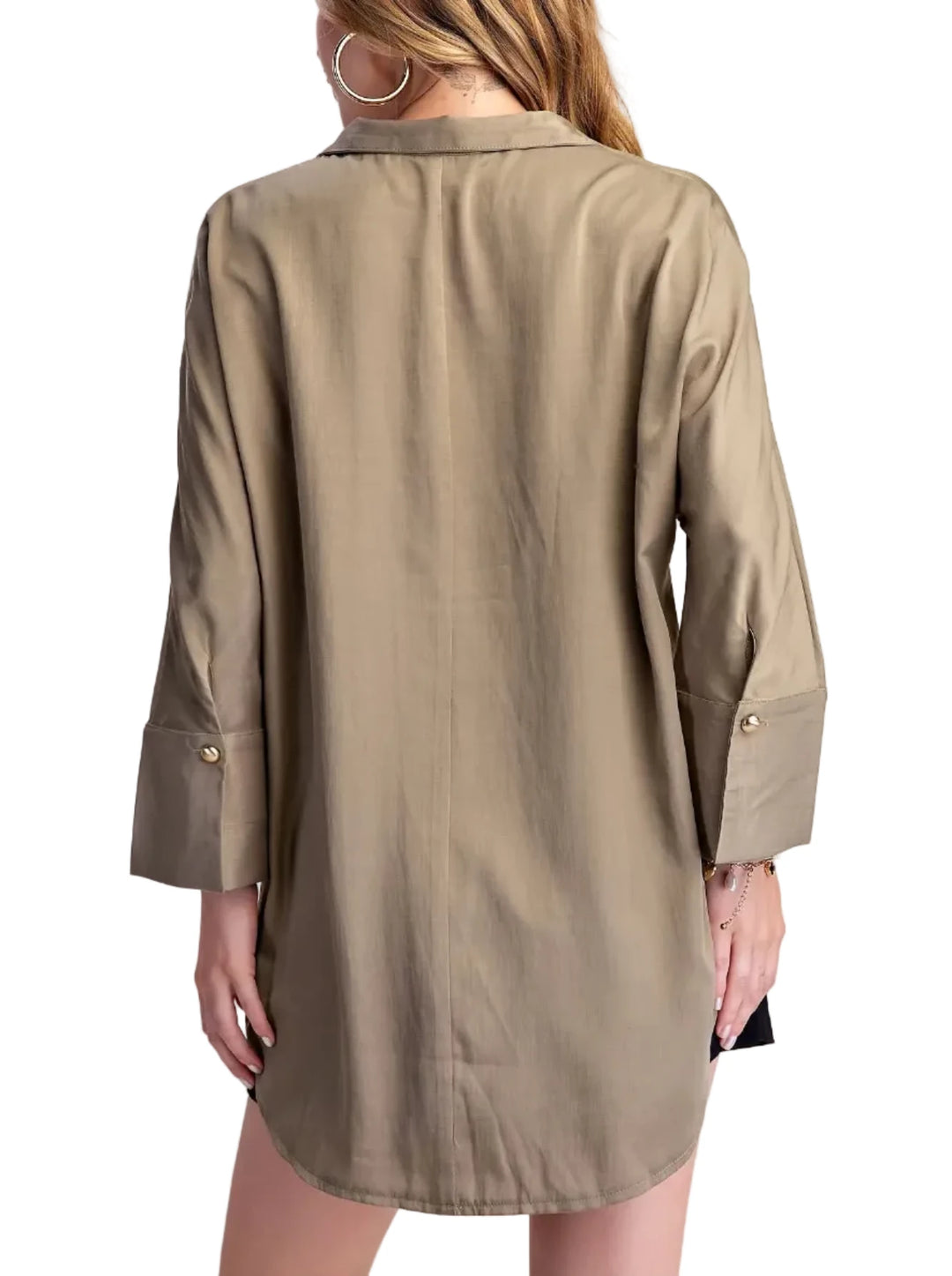Elevate your casual style with this chic collared shirt blouse. Crafted from a lightweight, breathable fabric with a subtle sheen, this top offers a sophisticated take on a classic shirt. The relaxed fit drapes beautifully, providing comfort and effortless style. Featuring a unique collar with a single, elegant gold-tone button closure at the placket, it adds a touch of refined detail. The long sleeves are finished with neat cuffs, and the curved hemline creates a flattering silhouette. Perfect for pairing 