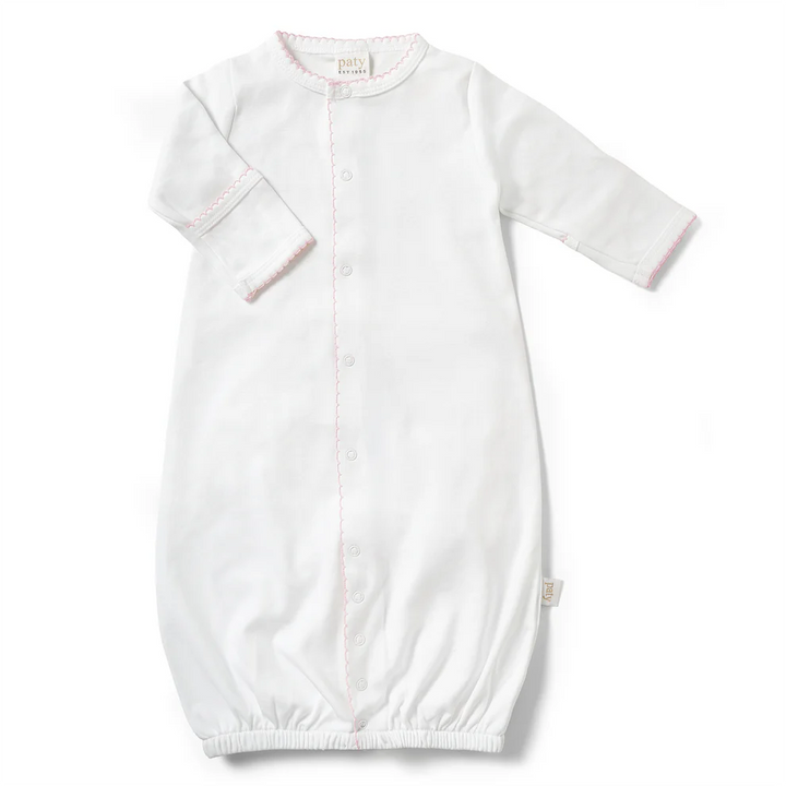 Designed with a gentle elasticized hem for easy diaper changes, this converter gown offers everyday comfort and effortless functionality. Built-in fold-over cuffs help protect delicate skin from scratches, making it a thoughtful take home outfit or cherished baby shower gift.&amp;nbsp; pink