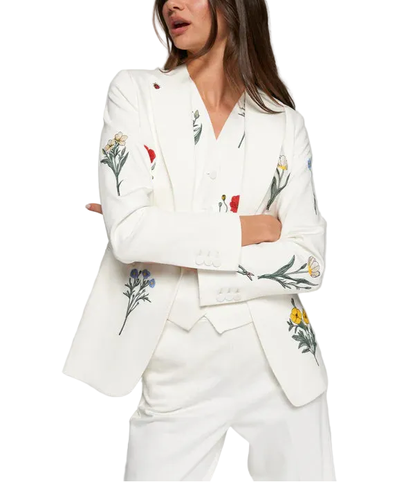 Elevate your everyday style with this crisp white blazer, adorned with delicate embroidered flowers that add a whimsical touch. Perfect for layering over your favorite Air Essentials basics or dressing up a casual outfit, this Vilagallo piece brings effortless sophistication with a hint of botanical charm. The structured silhouette flatters while the intricate floral details spark conversation. Whether you&