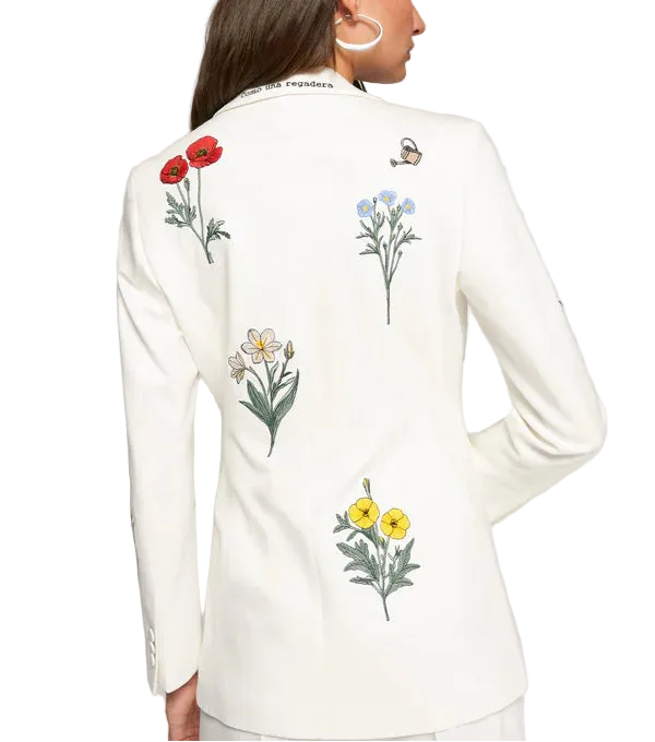 Elevate your everyday style with this crisp white blazer, adorned with delicate embroidered flowers that add a whimsical touch. Perfect for layering over your favorite Air Essentials basics or dressing up a casual outfit, this Vilagallo piece brings effortless sophistication with a hint of botanical charm. The structured silhouette flatters while the intricate floral details spark conversation. Whether you&