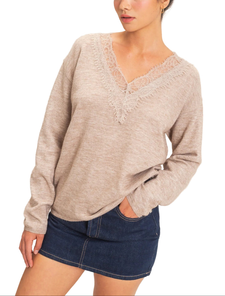 Elevate your everyday wardrobe with the Linda Lace Trim V-Neck Sweater. This refined piece features delicate lace detailing along the neckline, adding a touch of elegance to a timeless silhouette. The flattering V-neck design creates a lengthening effect, while the soft, quality knit provides all-day comfort. Perfect for layering or wearing solo, this versatile sweater transitions seamlessly from office to weekend. A wardrobe essential that pairs effortlessly with jeans, trousers, or skirts for countless st