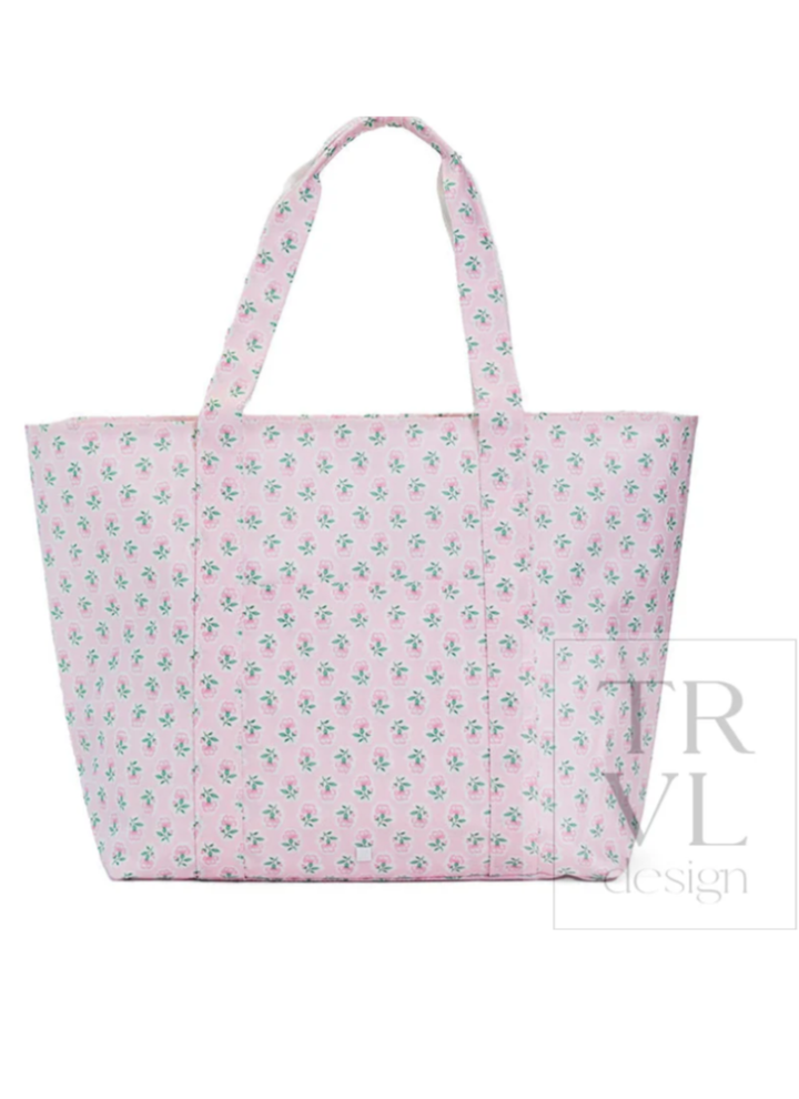 Pink tote bag with floral pattern on a white background