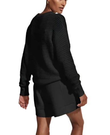 Made in a textured open knit to a relaxed silhouette, this contemporary crewneck style is beautifully light and breathable. Complete with a ribbed hem and cuffs, it can be layered over lifestyle or tennis looks for effortless transitional appeal.