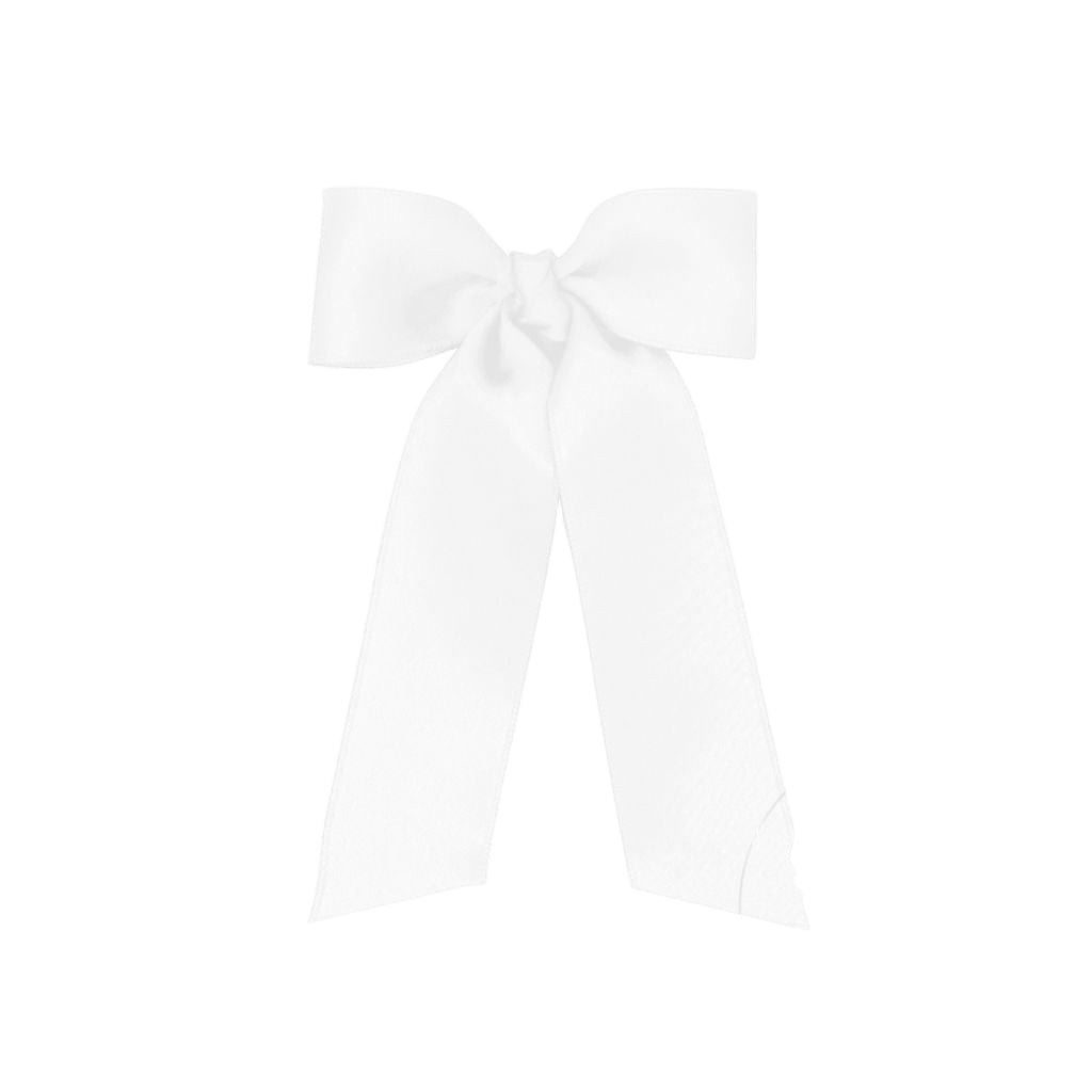 White hair tie with a bow on a white background