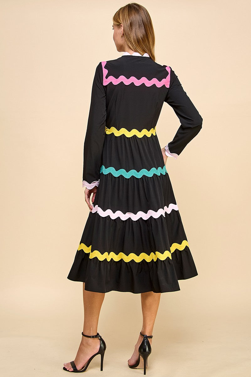 Long sleeve button up midi dress with colorful ricrac detail.