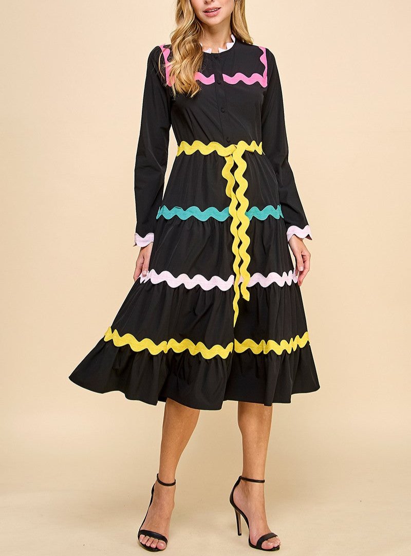 Long sleeve button up midi dress with colorful ricrac detail.