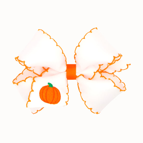 Bow with a small pumpkin design on a white background
