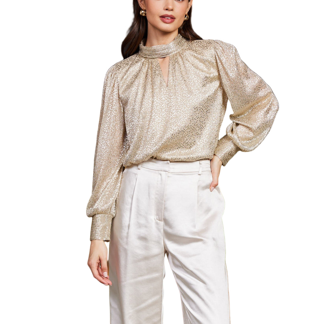 Shine bright in the Augusta Lurex Top in Gold, featuring a playful shirred bodice that hugs you just right. Its mock neck adds a chic twist, perfect for dressing up your look with a touch of sparkle and fun flair. Great for nights out or turning everyday moments into a celebration!