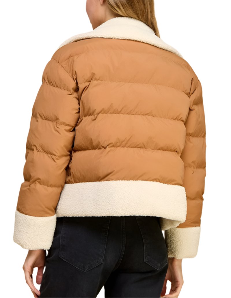 Padded puffer jacket with a sherpa trim, side pockets and an asymmetrical zipper closure.