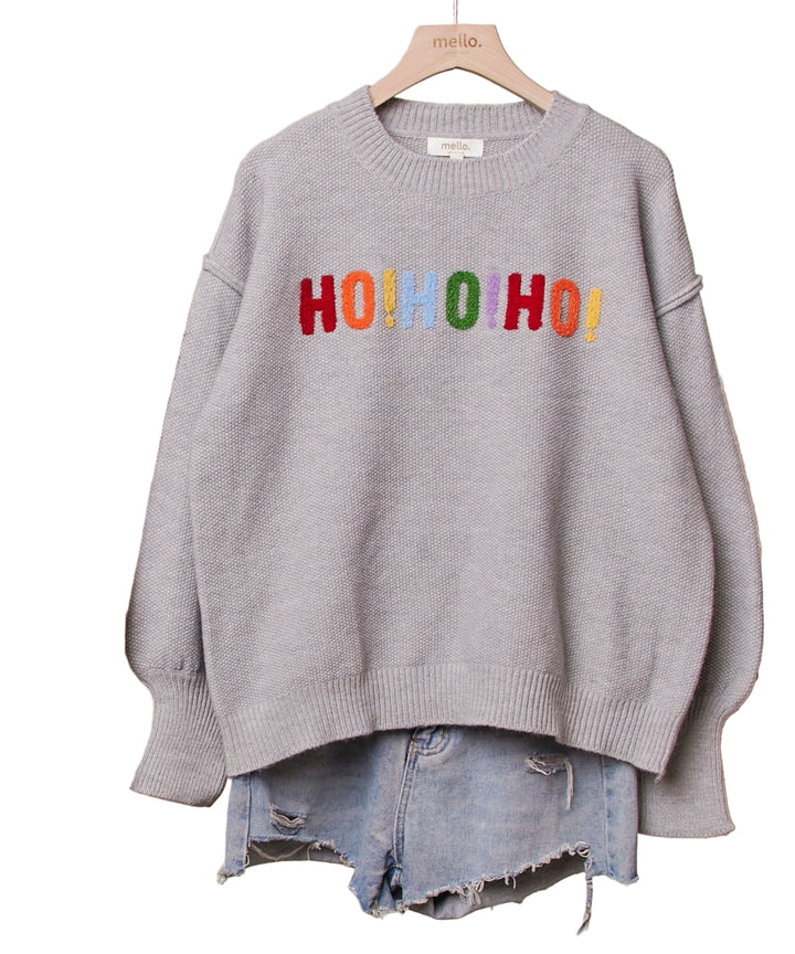 Celebrate the season in cozy style with this Oversize Christmas Sweater featuring festive lettering on both front and back. Its roomy fit keeps you comfy for holiday parties, while the bold text spreads cheer wherever you go. Perfect for sipping cocoa or rocking around the Christmas tree, this sweater makes festive fun effortless and playful.