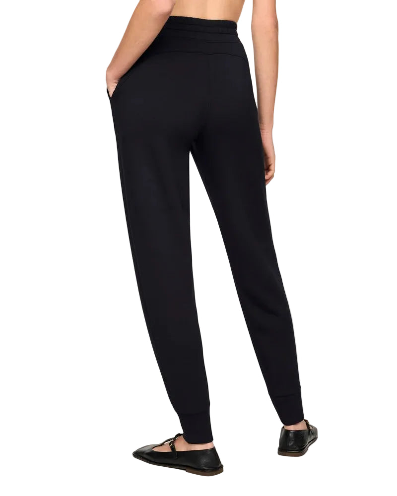 Our SPANX AirEssentials® Slim Cuff Jogger is made with our signature spacer fabric that's light-as-air, cloud-soft, and oh-so-smooth. These lounge pants feature a tapered, relaxed fit with a slim cuffed ankle, functional side pockets, and 4-way stretch for effortless style and all-day comfort. Sleek enough for travel or errands and cozy enough for lounging at home, this slim jogger will take you anywhere and everywhere.