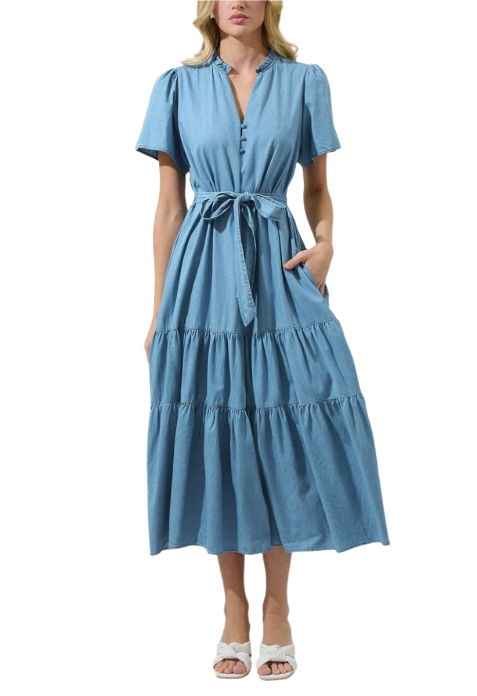 A must-have staple for your wardrobe, this Skylah Denim Britt Poplin Tiered Midi Dress. This midi dress has short sleeves that frame a split neckline with ruffles around and a lower button up detail. It has belt around the waist. You can easily style it with any heels. 