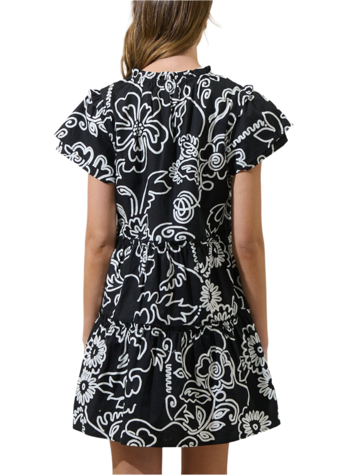 Get ready for an undeniably cute day in this dress. This flirty woven mini dress features a split neckline and short sleeves with ruffle layers. Fitted waist is accented with decorative tiers of ruffle trim that accent the flaring mini skirt below. Pair it with ankle boots and a crossbody bag for the perfect finish.